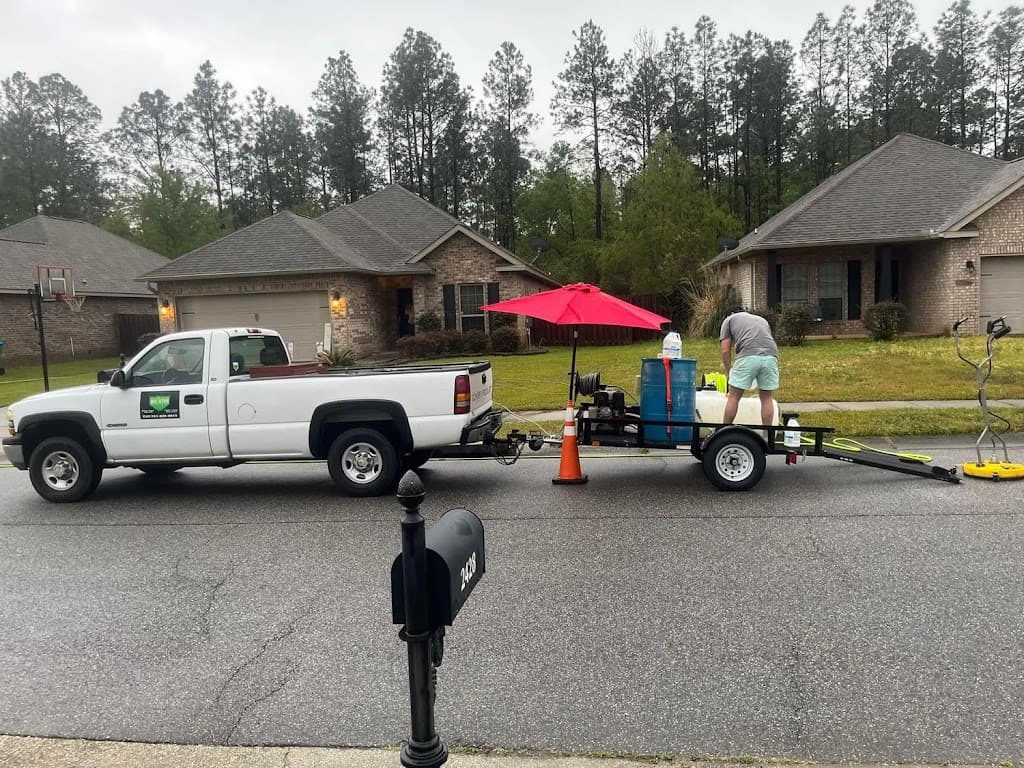 All-Star Lawn Care & Soft Washing truck and trailer equipment on a residential street